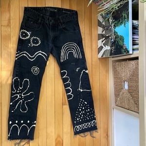 Black Guess jeans with bleach art